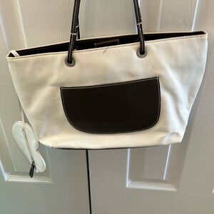 White handbag with brown pocket